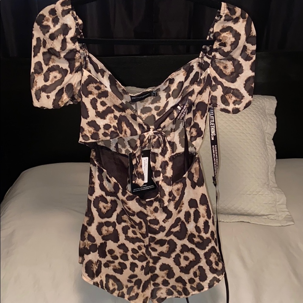 Leopard tie front play suit size 4